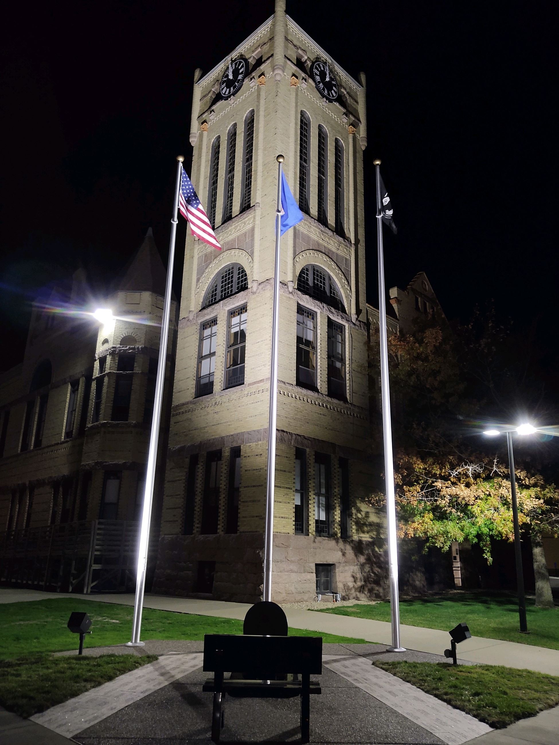 Historic Courthouse with Fallen Officer Monument at night
